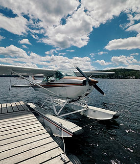 Seaplane at dock on Connecticut River beautiful sky